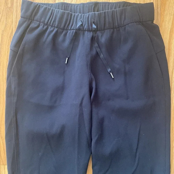 Lululemon On The Fly Pant *28" black pockets elastic waist + tie stretch ankle - Picture 6 of 9